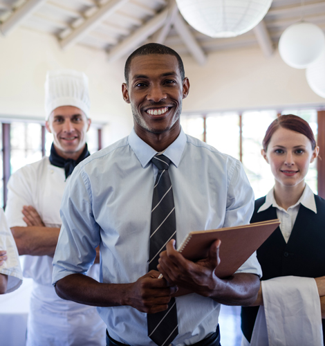 Group of Restaurant Staff Standing in Lobby - Referrals in Self Insurance for Restaurants with CRMBC