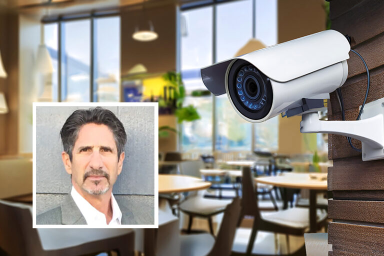 A surveillance camera hanging discreetly in a modern cafe, positioned to capture the vibrant atmosphere and activity while ensuring safety and security in the stylish, contemporary setting A Restaurant Owner’s Guide to Sub Rosa Investigations